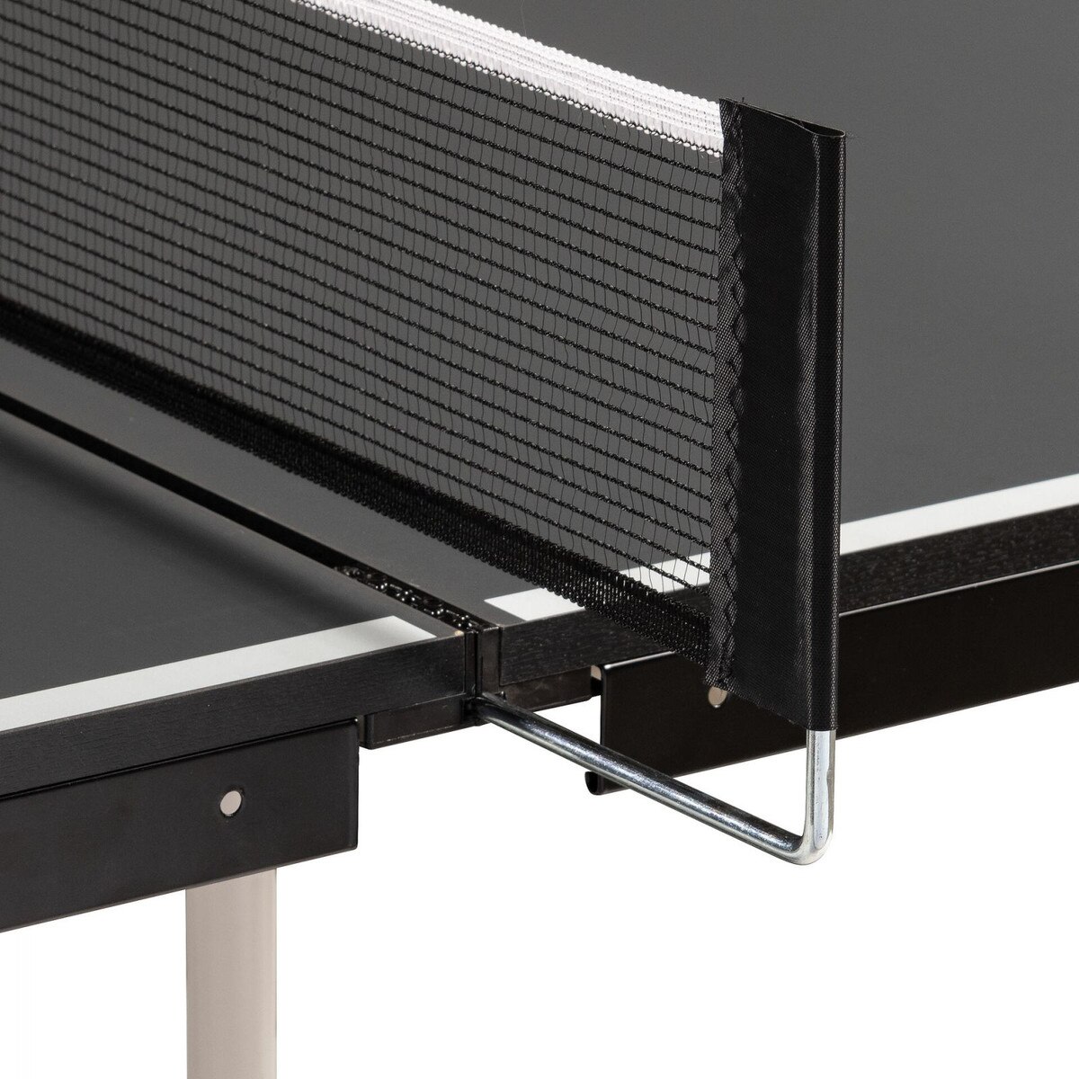 Pictured here is the Butterfly Timo Boll Joylite Indoor Ping Pong Table showing you its included net set attached to the table.